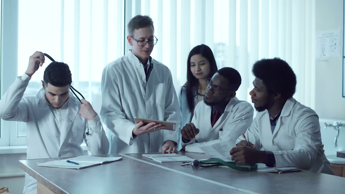 A care team reviewing a tablet together